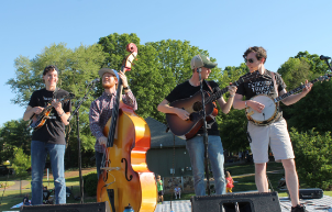 A string band playing music outside.