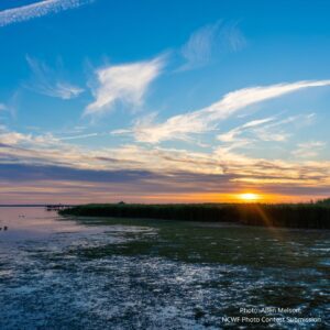 An image of the sunset over the North Carolina coast, demonstrating the Outer Coastal Plain element of the Coastal Plain, of which the Inner Coastal Plain is also a part and comprises the lions share of North Carolina land.