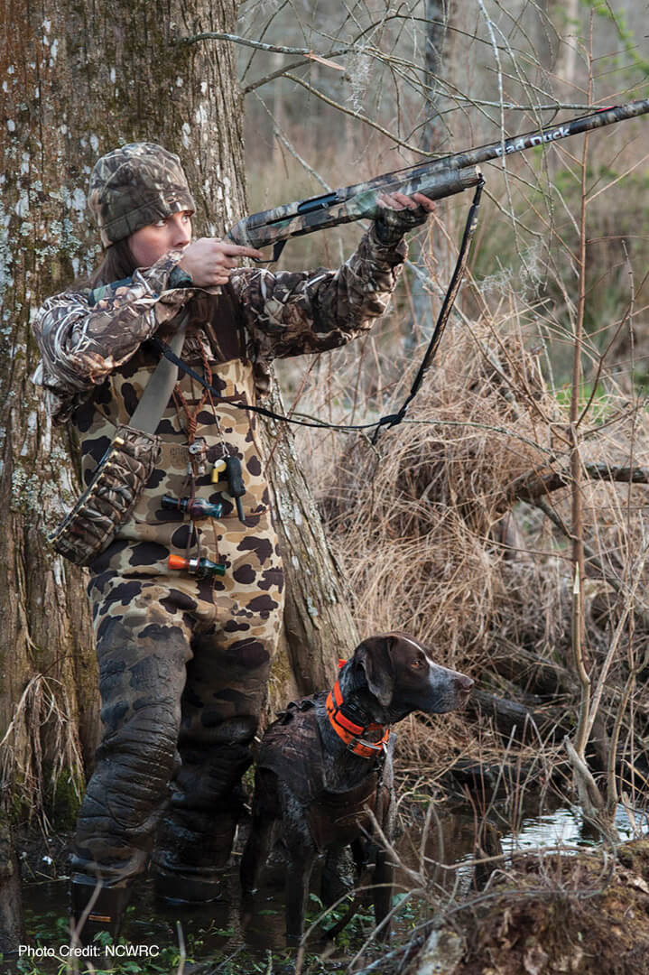 Woman bird hunting on public land.